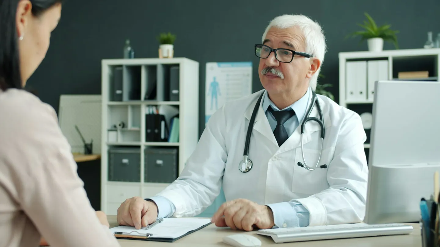Doctor and patient talking during a consultation in a Canadian clinic